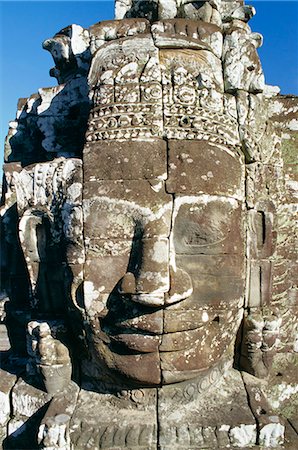 simsearch:841-02718675,k - Myriad stone heads typifying Cambodia in the Bayon Temple, Angkor, Siem Reap, Cambodia Photographie de stock - Premium Libres de Droits, Code: 6119-08739918