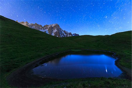 star trails - Stars reflected in a pool, Mont de la Saxe, Ferret Valley, Courmayeur, Aosta Valley, Italy, Europe Stock Photo - Premium Royalty-Free, Code: 6119-09062103