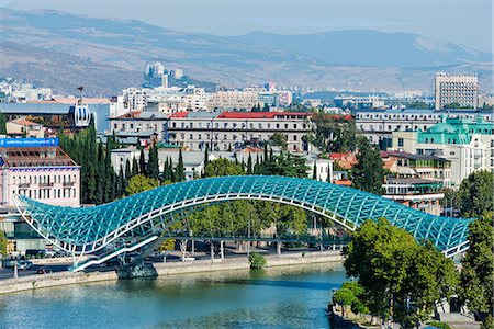 Peace Bridge over the Mtkvari Rver, designed by Italian architect Michele de Lucci, Tbilisi, Georgia, Caucasus, Asia Stock Photo - Premium Royalty-Free, Code: 6119-09073842