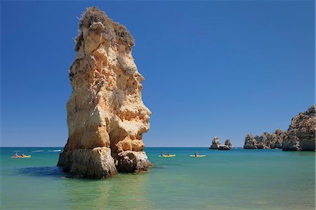 Praia da Dona Ana beach, group of kayaks on a trip to Ponta da Piedade Cape, Lagos, Algarve, Portugal, Europe Stock Photo - Premium Royalty-Free, Code: 6119-09085478