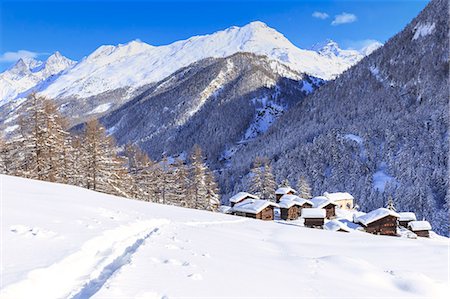 A trail in the snow leads to the traditional huts of Blatten, Zermatt, Canton of Valais (Wallis), Switzerland, Europe Stock Photo - Premium Royalty-Free, Code: 6119-09170207