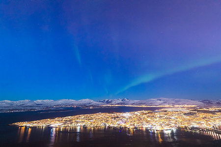 snow city - Northern Lights (Aurora borealis) on the city of Troms seen from Fjellheisen, Troms county, Norway, Scandinavia, Europe Stock Photo - Premium Royalty-Free, Code: 6119-09182461