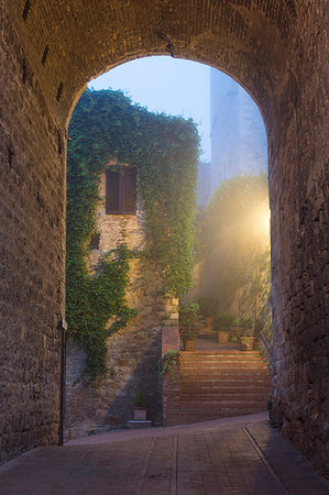 A misty dawn view of a street in San Gimignano, UNESCO World Heritage Site, Tuscany, Italy, Europe Stock Photo - Premium Royalty-Free, Code: 6119-09182796