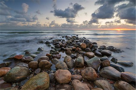 Rock breakwater in sea at sunrise, Munkerup, Kattegat Coast, Zealand, Denmark, Scandinavia, Europe Stock Photo - Premium Royalty-Free, Code: 6119-09127155