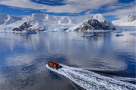 polar region - Early morning on a gorgeous day, elevated view of zodiac boat in Neko Harbour, Andvord Bay, Antarctic Continent, Antarctica, Polar Regions Stock Photo - Premium Royalty-Free, Code: 6119-09134747