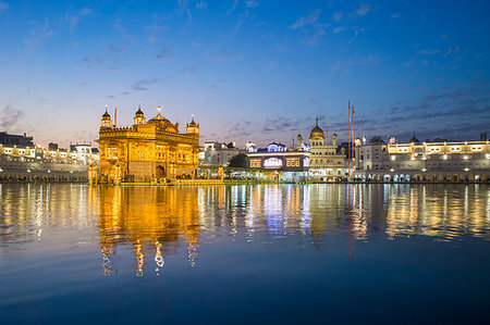 simsearch:400-06071678,k - The Golden Temple (Harmandir Sahib) and Amrit Sarovar (Pool of Nectar) (Lake of Nectar), illuminated at dusk, Amritsar, Punjab, India, Asia Stock Photo - Premium Royalty-Free, Code: 6119-09214304