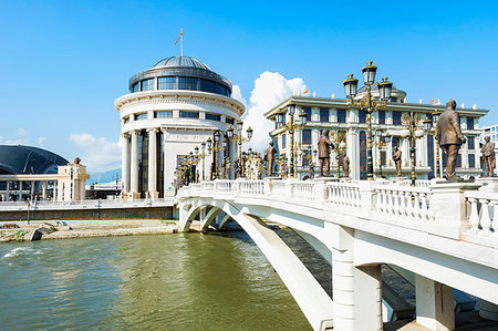 simsearch:600-06732629,k - Government buildings of the Financial Police Officeon the left as well as the Ministry of Foreign Affairs building on the right with the Art Bridge crossing the Vardar Rivr in Skopje, Macedonia Photographie de stock - Premium Libres de Droits, Code: 6119-09228497