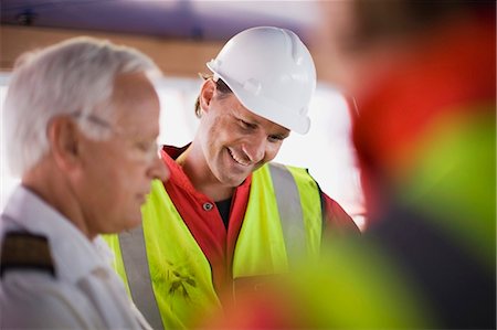 Captain talking to workers Stock Photo - Premium Royalty-Free, Code: 6122-07693066