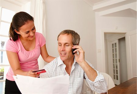 simsearch:649-06717020,k - Couple pay bill with credit card Stock Photo - Premium Royalty-Free, Code: 6122-07693408