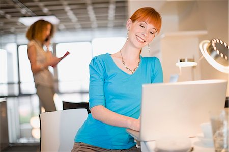simsearch:649-05648787,k - Businesswoman using laptop in office Stock Photo - Premium Royalty-Free, Code: 6122-07693990