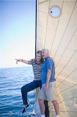 simsearch:6122-07699789,k - Older couple standing on sailboat Stock Photo - Premium Royalty-Free, Code: 6122-07694038