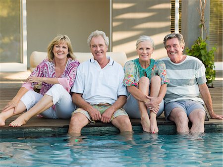 senior citizens pool - Mature friends by swimming pool Stock Photo - Premium Royalty-Free, Code: 6122-07694621