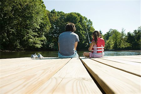 Father and daughter fishing from jetty Stock Photo - Premium Royalty-Free, Code: 6122-07695455