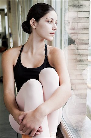 Ballerina looking through window Stock Photo - Premium Royalty-Free, Code: 6122-07695430
