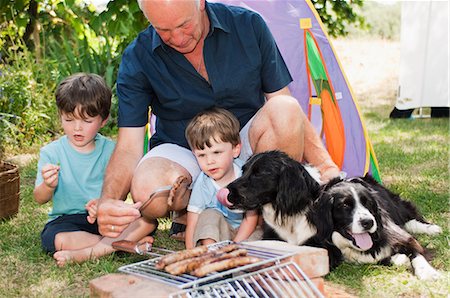 simsearch:6122-07698204,k - Grandfather and grandsons having barbecue Stock Photo - Premium Royalty-Free, Code: 6122-07696708