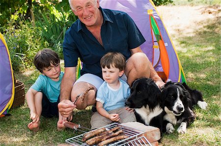 simsearch:6122-07698204,k - Grandfather and grandsons having barbecue Stock Photo - Premium Royalty-Free, Code: 6122-07696709