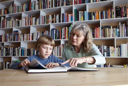 simsearch:6122-07698204,k - Woman and grandson reading together Stock Photo - Premium Royalty-Free, Code: 6122-07699002