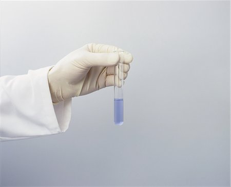 simsearch:6113-07589192,k - Scientist in latex glove with test tube Stock Photo - Premium Royalty-Free, Code: 6122-07699274