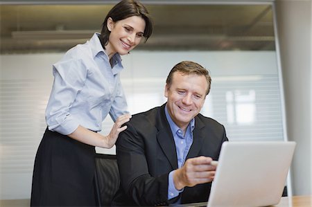 simsearch:649-05648787,k - Business people working together Stock Photo - Premium Royalty-Free, Code: 6122-07699408