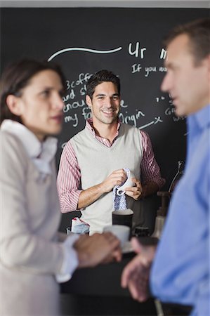 simsearch:649-06000952,k - Worker behind counter at cafe Stock Photo - Premium Royalty-Free, Code: 6122-07699426