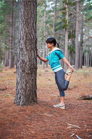 simsearch:649-04247797,k - Runner stretching in forest Stock Photo - Premium Royalty-Free, Code: 6122-07700483