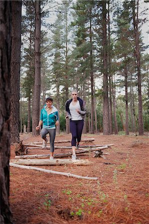 Women running in forest Stock Photo - Premium Royalty-Free, Code: 6122-07700485