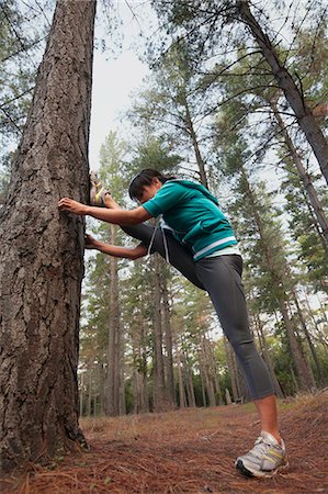 simsearch:695-05768377,k - Runner stretching in forest Stock Photo - Premium Royalty-Free, Code: 6122-07700489