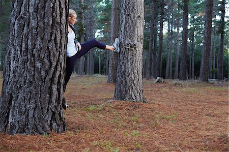 simsearch:649-04247797,k - Runner stretching in forest Stock Photo - Premium Royalty-Free, Code: 6122-07700494