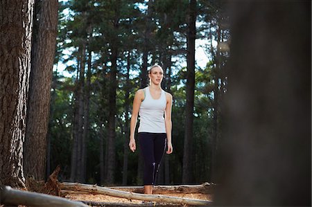 daytime fatigue - Woman walking in forest Stock Photo - Premium Royalty-Free, Code: 6122-07700496