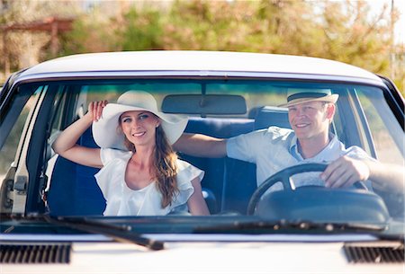 romance in car - Newlywed couple riding in car Stock Photo - Premium Royalty-Free, Code: 6122-07700577