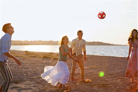 friends playing football - People playing with soccer ball on beach Stock Photo - Premium Royalty-Free, Code: 6122-07700588