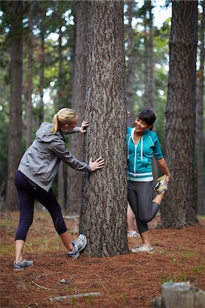 simsearch:695-05768377,k - Runners stretching in forest Stock Photo - Premium Royalty-Free, Code: 6122-07700500