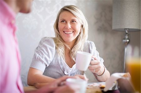 simsearch:6122-07704462,k - Couple drinking coffee at breakfast Stock Photo - Premium Royalty-Free, Code: 6122-07700738