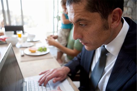 simsearch:649-05648787,k - Close up of businessman using laptop Stock Photo - Premium Royalty-Free, Code: 6122-07701101