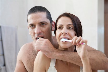 simsearch:649-06717020,k - Couple brushing their teeth in bathroom Stock Photo - Premium Royalty-Free, Code: 6122-07701127