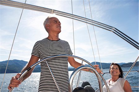 Older couple relaxing on sailboat Stock Photo - Premium Royalty-Free, Code: 6122-07701380
