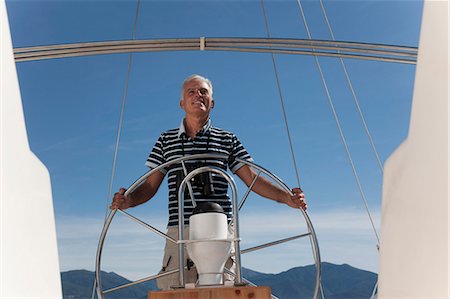 Older man sailing Stock Photo - Premium Royalty-Free, Code: 6122-07701384