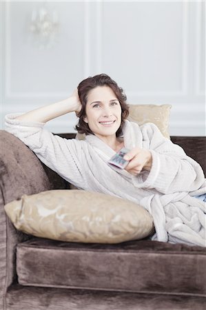 simsearch:6113-07731119,k - Woman in bathrobe watching television Stock Photo - Premium Royalty-Free, Code: 6122-07701612