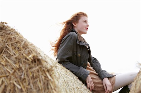 red hair girl preteen not freckles not illustration and one person - Teenage girl resting on haybales Stock Photo - Premium Royalty-Free, Code: 6122-07702705