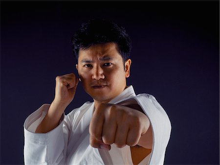 self discipline - Man practicing martial arts Stock Photo - Premium Royalty-Free, Code: 6122-07702998