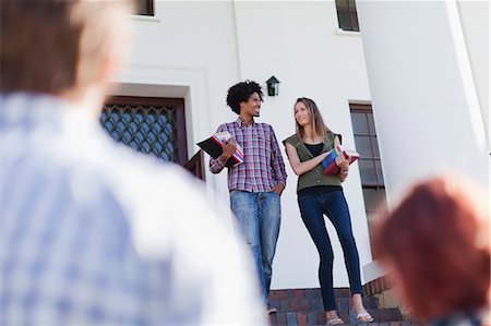Students walking together on campus Stock Photo - Premium Royalty-Free, Code: 6122-07703583