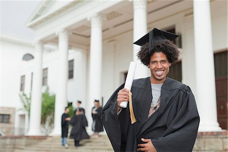 simsearch:6113-07791483,k - Graduate holding his degree on campus Stock Photo - Premium Royalty-Free, Code: 6122-07703608