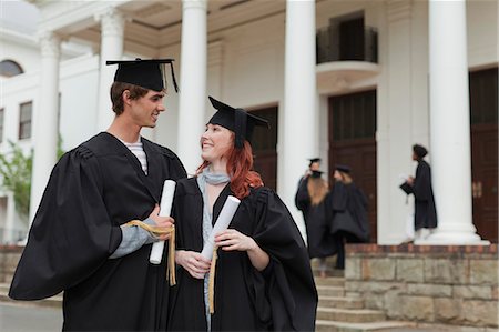 Graduates with their degrees on campus Stock Photo - Premium Royalty-Free, Code: 6122-07703611