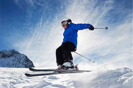 simsearch:649-05555429,k - Boy skiing on snowy mountainside Stock Photo - Premium Royalty-Free, Code: 6122-07703939