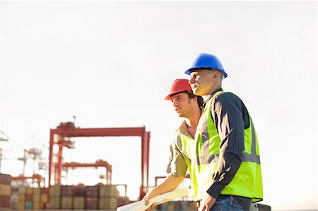 Construction workers talking on site Stock Photo - Premium Royalty-Free, Code: 6122-07704023