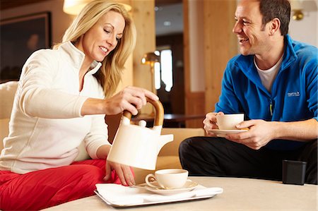 simsearch:6122-07704462,k - Couple having cup of tea together Stock Photo - Premium Royalty-Free, Code: 6122-07704448