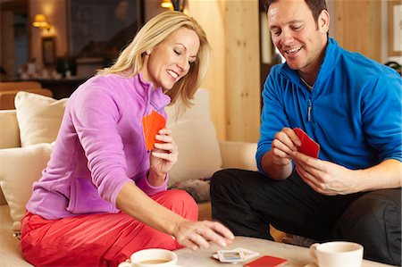 simsearch:6122-07704462,k - Couple playing card games together Stock Photo - Premium Royalty-Free, Code: 6122-07704452