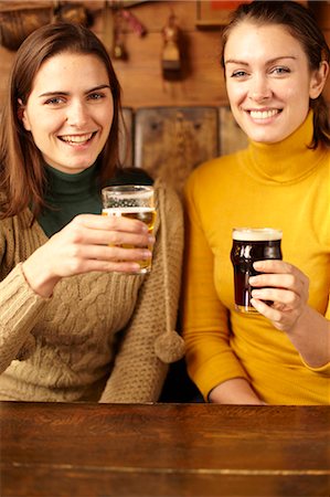 Women drinking beer in pub Stock Photo - Premium Royalty-Free, Code: 6122-07704408