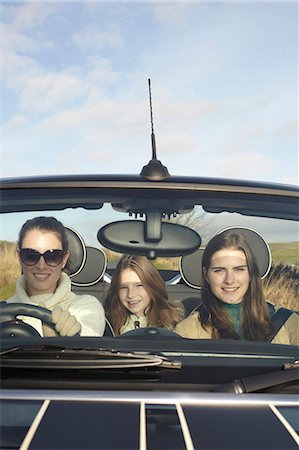 Family driving in rural landscape Stock Photo - Premium Royalty-Free, Code: 6122-07704416