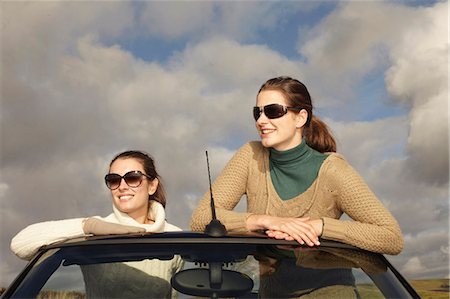 Women standing up in convertible Stock Photo - Premium Royalty-Free, Code: 6122-07704420
